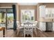 Breakfast nook with white table and chairs, looking out to the backyard at 5429 E Barwick Dr, Cave Creek, AZ 85331