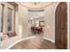 Entryway with tile flooring, seating area, and views into the dining room and living areas at 5429 E Barwick Dr, Cave Creek, AZ 85331