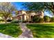 Beautiful two-story home with manicured lawn and inviting walkway at 5429 E Barwick Dr, Cave Creek, AZ 85331