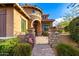 Elegant home exterior with arched entryway and decorative gate at 5429 E Barwick Dr, Cave Creek, AZ 85331