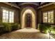 Elegant entryway with ornate iron door and stone accents at 5429 E Barwick Dr, Cave Creek, AZ 85331