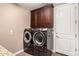 Laundry room with washer, dryer, and ample storage at 5429 E Barwick Dr, Cave Creek, AZ 85331