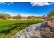 Community park with grassy area and walking path at 5429 E Barwick Dr, Cave Creek, AZ 85331