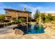 Stunning pool with spa and rock waterfall feature at 5429 E Barwick Dr, Cave Creek, AZ 85331