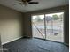 Bright bedroom with sliding glass doors leading to a balcony at 5813 N 59Th Dr, Glendale, AZ 85301