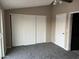 Spacious bedroom with ample closet space and carpeting at 5813 N 59Th Dr, Glendale, AZ 85301