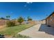 Backyard features patio, grass, and play equipment at 5934 W Coronado Rd, Phoenix, AZ 85035