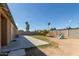 Backyard with patio, grass, and playset at 5934 W Coronado Rd, Phoenix, AZ 85035