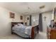 Bedroom with double bed, ceiling fan, and wood dresser at 5934 W Coronado Rd, Phoenix, AZ 85035