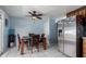 Bright dining area with table and chairs, and stainless steel refrigerator at 5934 W Coronado Rd, Phoenix, AZ 85035