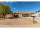 Tan single story house with front yard and mailbox at 5934 W Coronado Rd, Phoenix, AZ 85035