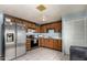 View of kitchen with stainless steel appliances and wood cabinets at 5934 W Coronado Rd, Phoenix, AZ 85035