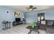 Living room with sectional sofa, coffee table, and ceiling fan at 5934 W Coronado Rd, Phoenix, AZ 85035