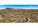 Aerial view of a large neighborhood with desert landscape and mountain views at 6033 E Pebbles Ct, Cave Creek, AZ 85331