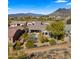 Aerial view of property, neighborhood, and mountain backdrop at 6033 E Pebbles Ct, Cave Creek, AZ 85331