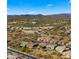 Aerial view of neighborhood homes near a school and major intersection at 6033 E Pebbles Ct, Cave Creek, AZ 85331