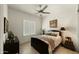 Bedroom with ceiling fan, plantation shutters, and neutral decor at 6033 E Pebbles Ct, Cave Creek, AZ 85331