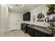 Laundry room with granite countertop and cabinets at 6033 E Pebbles Ct, Cave Creek, AZ 85331