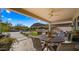 Patio with seating, artificial turf and pool view at 6033 E Pebbles Ct, Cave Creek, AZ 85331