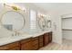 Elegant bathroom with dual vanities, marble counters, and gold accents at 6231 E Mark Way # 32, Cave Creek, AZ 85331