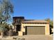 Single-story home with a two-car garage and desert landscaping at 6231 E Mark Way # 32, Cave Creek, AZ 85331