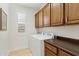 Bright laundry room with washer, dryer, and ample cabinetry at 6231 E Mark Way # 32, Cave Creek, AZ 85331