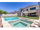 Luxury backyard oasis featuring a sparkling pool, spa, and patio area at 630 W Echo Ln, Phoenix, AZ 85021