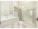 Modern bathroom with white vanity, quartz countertop and shower at 630 W Echo Ln, Phoenix, AZ 85021