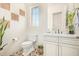 Elegant bathroom with patterned tile floor and white vanity at 630 W Echo Ln, Phoenix, AZ 85021