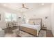 Main bedroom with a king-size bed and an en-suite bathroom at 630 W Echo Ln, Phoenix, AZ 85021