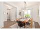 Bright dining room with wood table and neutral decor at 630 W Echo Ln, Phoenix, AZ 85021