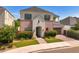 Two-story brick home with landscaped front yard and attached garage at 630 W Echo Ln, Phoenix, AZ 85021