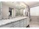 Spa-like bathroom featuring double sinks, granite countertops, and a large shower at 631 W Stanley Ave, San Tan Valley, AZ 85140