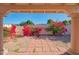 View through covered patio, showing red bougainvillea at 6425 N 79Th St, Scottsdale, AZ 85250