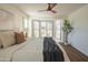 King bedroom with large windows and a ceiling fan at 6425 N 79Th St, Scottsdale, AZ 85250