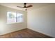 Bright bedroom with hardwood floors and a ceiling fan at 6425 N 79Th St, Scottsdale, AZ 85250