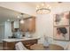 Light and airy dining area with a round table and modern chandelier at 6425 N 79Th St, Scottsdale, AZ 85250