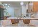 A round dining table sits in front of a kitchen island at 6425 N 79Th St, Scottsdale, AZ 85250