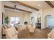 Bright living room with fireplace, high ceilings, and built-in bar at 6425 N 79Th St, Scottsdale, AZ 85250