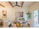 Bright living room with hardwood floors, modern furniture, and a view to the patio at 6425 N 79Th St, Scottsdale, AZ 85250