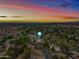 Aerial view of property showing house and surrounding neighborhood at sunset at 715 S Cactus Wren St, Gilbert, AZ 85296