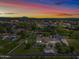 Aerial view of property showcasing house, pool, and expansive grounds at dusk at 715 S Cactus Wren St, Gilbert, AZ 85296