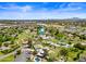 Aerial view showcasing a large property with a pool and surrounding landscape at 715 S Cactus Wren St, Gilbert, AZ 85296