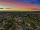 Aerial view of property showing house and surrounding neighborhood at sunset at 715 S Cactus Wren St, Gilbert, AZ 85296