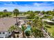 An aerial view of a home with a sparkling pool, lush landscaping, and outdoor entertaining area at 715 S Cactus Wren St, Gilbert, AZ 85296