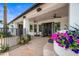 Back patio with seating area and lush flower planters at 715 S Cactus Wren St, Gilbert, AZ 85296