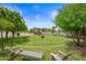 Landscaped backyard with a stone labyrinth and seating area at 715 S Cactus Wren St, Gilbert, AZ 85296