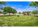 Spacious backyard with a stone labyrinth and covered patio at 715 S Cactus Wren St, Gilbert, AZ 85296