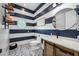 Charming bathroom with a navy and white striped accent wall at 715 S Cactus Wren St, Gilbert, AZ 85296