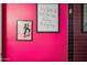 Pink accent wall with framed Grease artwork at 715 S Cactus Wren St, Gilbert, AZ 85296